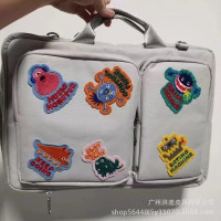 小衆設計怪物貼布筆記型電腦包斜背16英寸女電腦文件手提收納包中