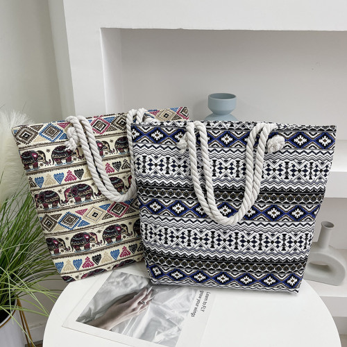 帆布包大容量女單肩包2024新款時尚印花出行托特包民族風印花