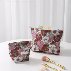 新款高級感文藝提花化妝包女士花朵手拿包高顔值可攜式收納包零錢包