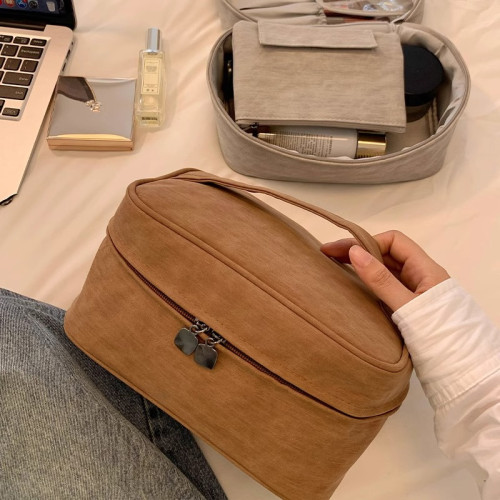 化妝包可攜式女2024新款高級分區大容量化妝品收納包出差旅行洗漱包