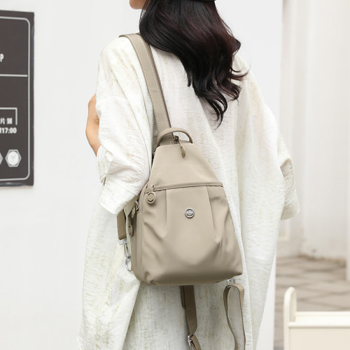 迷你雙肩包2025新款簡約百搭防盜女士胸前包時尚牛津布休閒小後背包