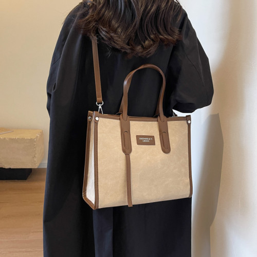 上班通勤包2025女大容量手提女包包新款感帆布撞色百搭斜背托特包