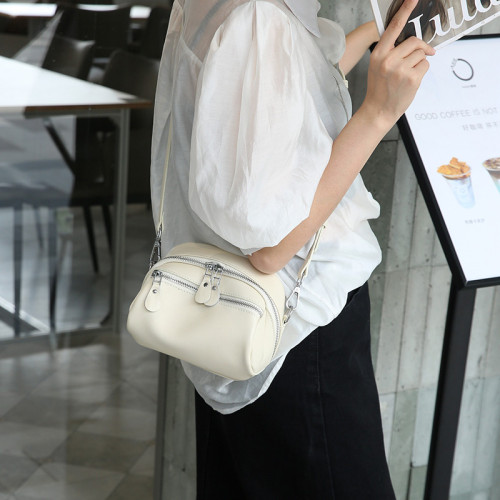 真皮斜後背包女2025新款女士包包夏季頭層牛皮小包大容量寬肩小圓包
