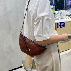 包包女2025新款小衆頭層牛皮餃子包 大容量真皮可頌斜背牛角包女