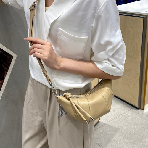包包女2025新款小衆頭層牛皮餃子包 大容量真皮可頌斜背牛角包女