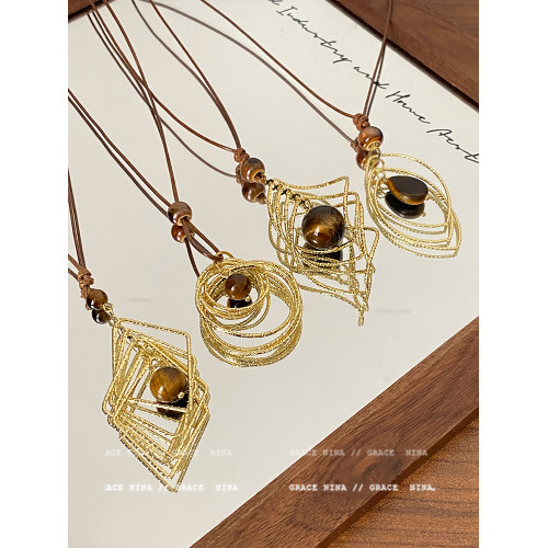 復古輕奢美拉德金屬線纏繞虎眼石吊墜項鍊女長款毛衣鏈配飾高級感