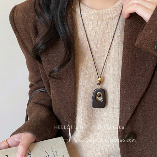 復古咖色虎眼石鏤空吊墜項鍊女秋冬獨特設計感長款掛脖毛衣鏈配飾 復古咖色虎眼石鏤空吊墜項鍊女秋冬獨特設計感長款掛脖毛衣鏈配飾