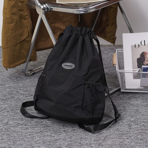 抽繩雙肩包女2024新款束口袋運動輕便雙肩包旅行包男戶外簡約後後背包