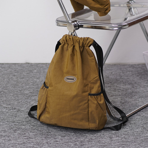 抽繩雙肩包女2024新款束口袋運動輕便雙肩包旅行包男戶外簡約後後背包