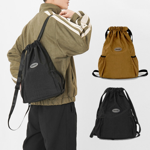 抽繩雙肩包女2024新款束口袋運動輕便雙肩包旅行包男戶外簡約後後背包
