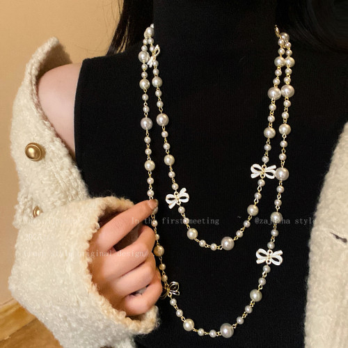 小香風蝴蝶結珍珠雙層項鍊女款高級感輕奢精緻小衆毛衣鏈長款配飾