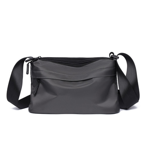 新款斜後後背包包男款挎包簡約百搭男士外出隨身小包可攜式休閒單肩後後背包