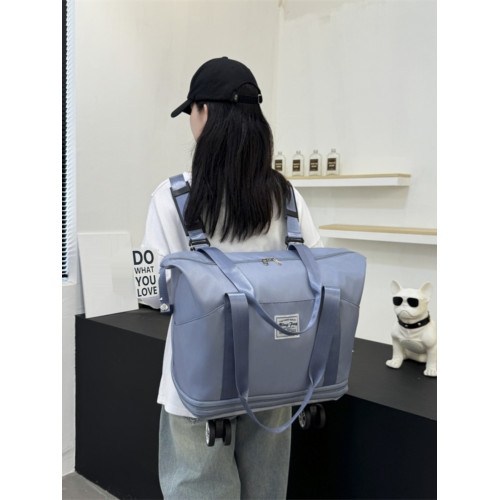 新款大容量帶輪旅行包免托運可登機包可裝被子雙肩背萬向輪旅行包