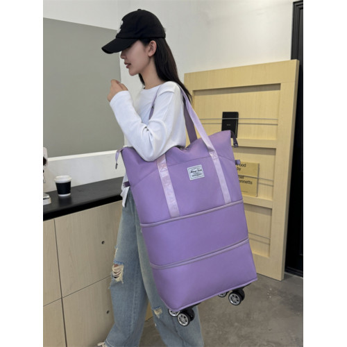 新款大容量帶輪旅行包免托運可登機包可裝被子雙肩背萬向輪旅行包