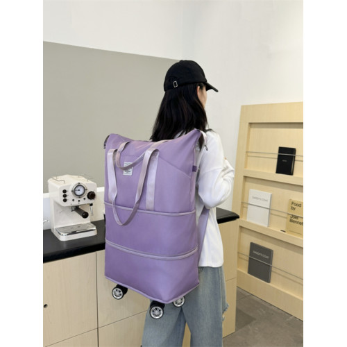 新款大容量帶輪旅行包免托運可登機包可裝被子雙肩背萬向輪旅行包