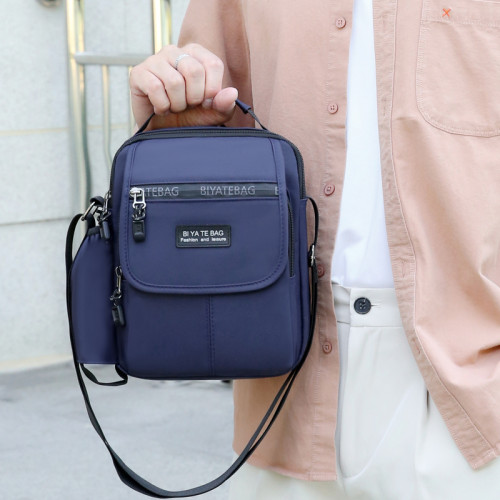 新款防潑水中老年人男包外出旅行包水杯位單肩包斜後後背包旅遊小方包