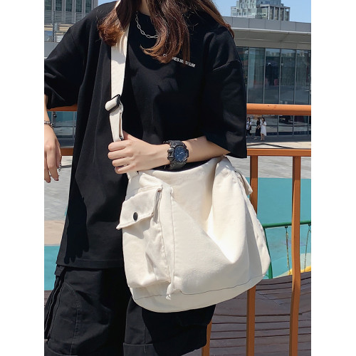 日系復古帆布包男生休閒大容量斜後後背包ins潮牌單肩包女通勤郵差包