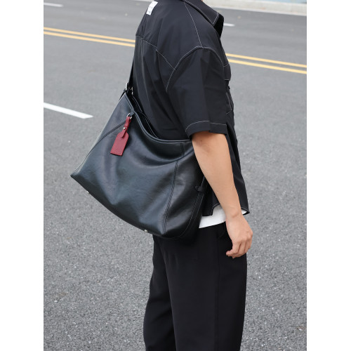 左千戶包2026新款爆款黑武士牛皮斜後後背包男包大容量通勤包電腦包