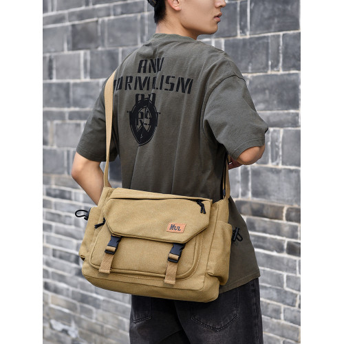 男士斜後後背包2025新款休閒大容量復古帆布郵差包短途騎行通勤單肩包