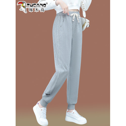 啄木鳥酒紅色運動褲女2026新款春秋女褲休閒束腳女士衛褲加絨褲子