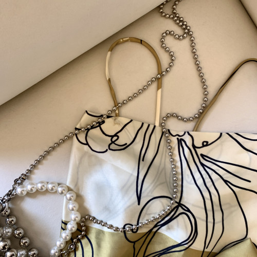 專櫃撤廻剪標復古綁帶蝴蝶結吊帶背心女夏季新款別致修身外穿上衣