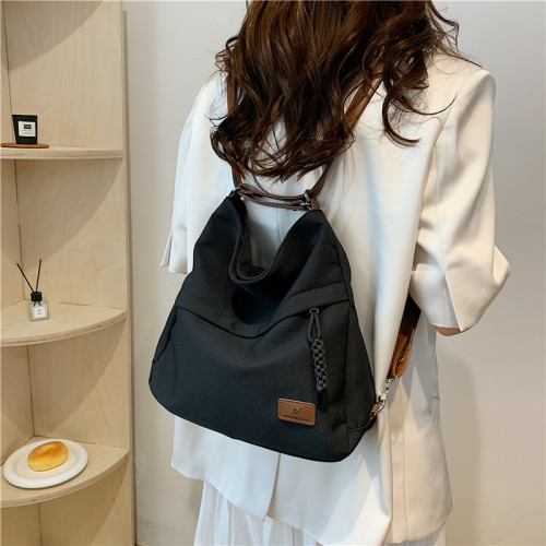 一包三用托特包後後背包女新款可雙肩單肩斜背帆布包通勤大容量多功能