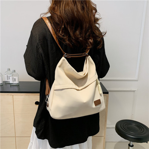 一包三用托特包後後背包女新款可雙肩單肩斜背帆布包通勤大容量多功能