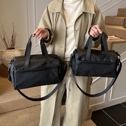 大容量防水帆布包女手提單肩斜後後背包休閒通勤健身包黑色短途旅行包