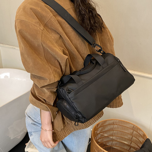 大容量防水帆布包女手提單肩斜後後背包休閒通勤健身包黑色短途旅行包