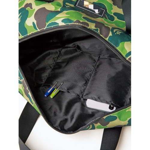 原單BAPE日雜附錄猿人頭迷彩防水圓筒大容量斜後後背包旅行手提運動包