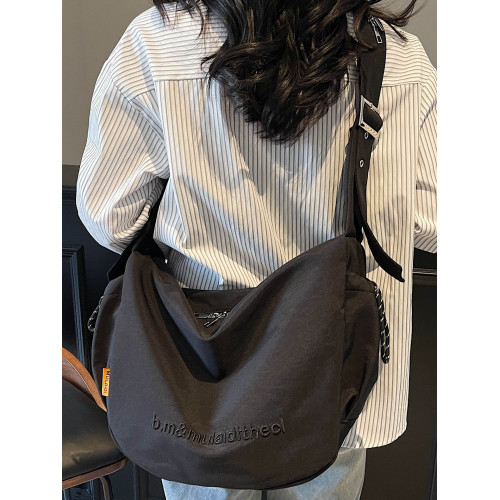 2026帆布包女士2025新款超火男士餃子包上班通勤大容量單肩斜後後背包