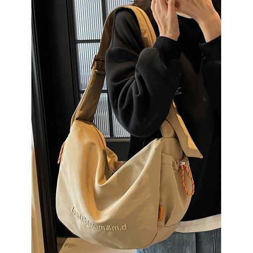 2026帆布包女士2025新款超火男士餃子包上班通勤大容量單肩斜後後背包