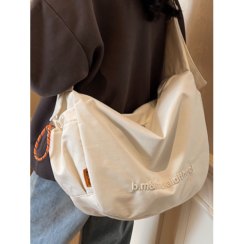 2026帆布包女士2025新款超火男士餃子包上班通勤大容量單肩斜後後背包