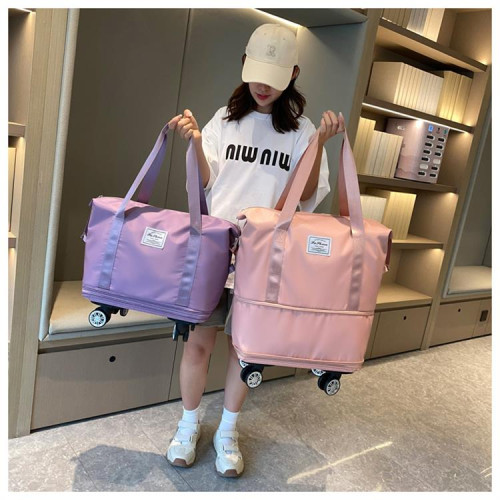 萬向輪旅行包2024年新款可攜式手拉行李袋帶滑輪收納包大容量健身包