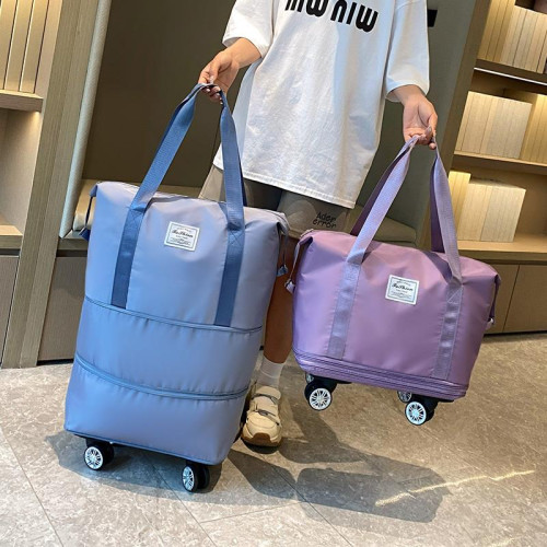 萬向輪旅行包2024年新款可攜式手拉行李袋帶滑輪收納包大容量健身包