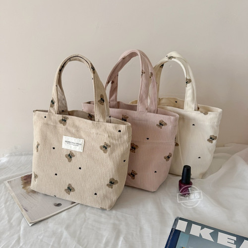 秋冬新款手提小號學生女通勤零食手機雜物收納燈芯絨帆布袋手拎包