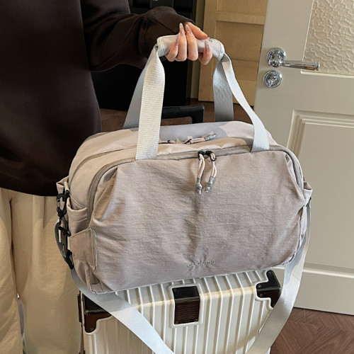 旅行包女大容量手提輕便防水行李袋短途外出旅遊登機待産包收納袋