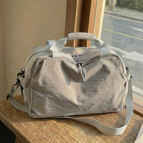 旅行包女大容量手提輕便防水行李袋短途外出旅遊登機待産包收納袋