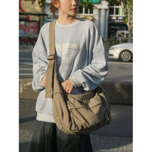 日系慵懶風帆布包包女2025秋冬新款通勤單肩托特包男文藝生斜後後背包