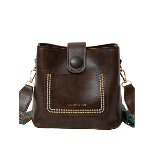 小衆韓版復古秋冬百搭通勤寬肩帶斜後後背包包女2024新款高級感水桶包