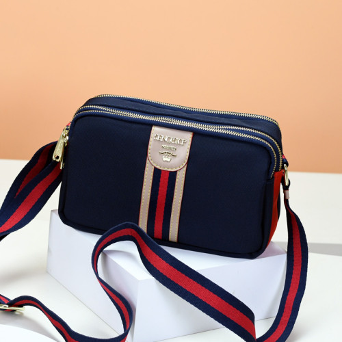 斜背牛津布包包女撞色配皮小方包2025歐美時尚新款多層休閒單肩包