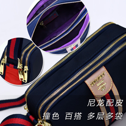 斜背牛津布包包女撞色配皮小方包2025歐美時尚新款多層休閒單肩包