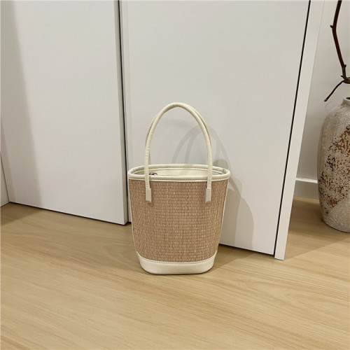 小髒櫃 2025夏季新款法式小衆時尚撞色草編包手提單肩斜背水桶包