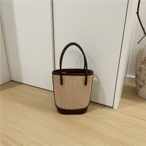 小髒櫃 2025夏季新款法式小衆時尚撞色草編包手提單肩斜背水桶包