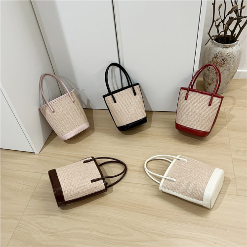 小髒櫃 2025夏季新款法式小衆時尚撞色草編包手提單肩斜背水桶包