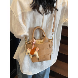 包包女式2025新款夏天超火黃色編織水桶包輕奢小衆高級感斜背女包