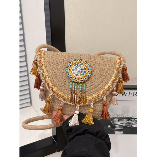 民族風流蘇小包包女2025新款時尚編織水桶包春夏高級感單肩斜後後背包