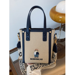 北包包2025新款原創小熊帆布水桶包寬肩帶斜背時尚百搭手提手機包