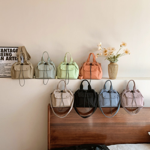 包包高質感新款水桶包韓版尼龍布小包時尚百搭休閒抽繩手提斜後後背包