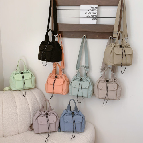 包包高質感新款水桶包韓版尼龍布小包時尚百搭休閒抽繩手提斜後後背包